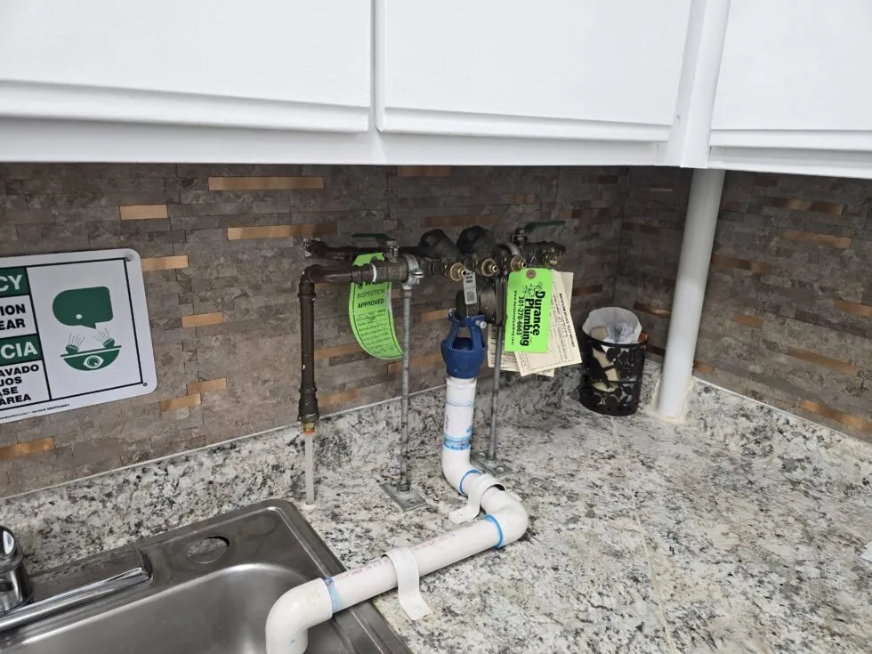 Backflow preventer testing at a dental office in Silver Spring, MD by Durance Plumbing.