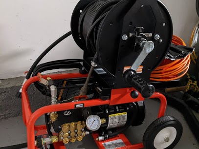 Drain cleaning machine clearing a clogged drain in Silver Spring MD by Durance Plumbing