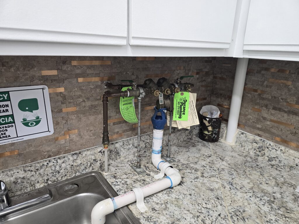 Backflow preventer testing at a dental office in Silver Spring, MD by Durance Plumbing.