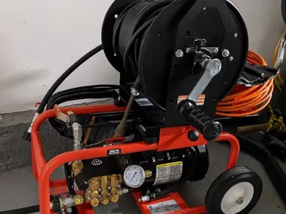 Drain cleaning machine clearing a clogged drain in Silver Spring MD by Durance Plumbing