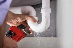 plumber-fixing-leaky-pipe